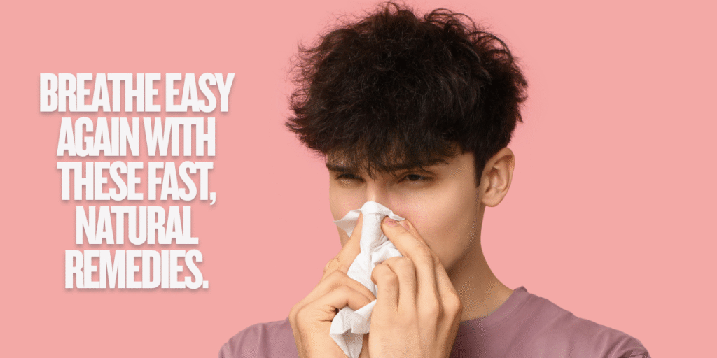 Young man blowing his nose