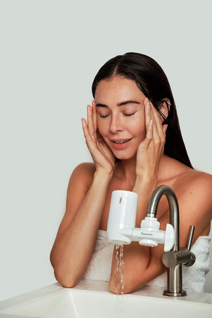 Woman enjoying glowing skin after using Filterbaby Water Filter